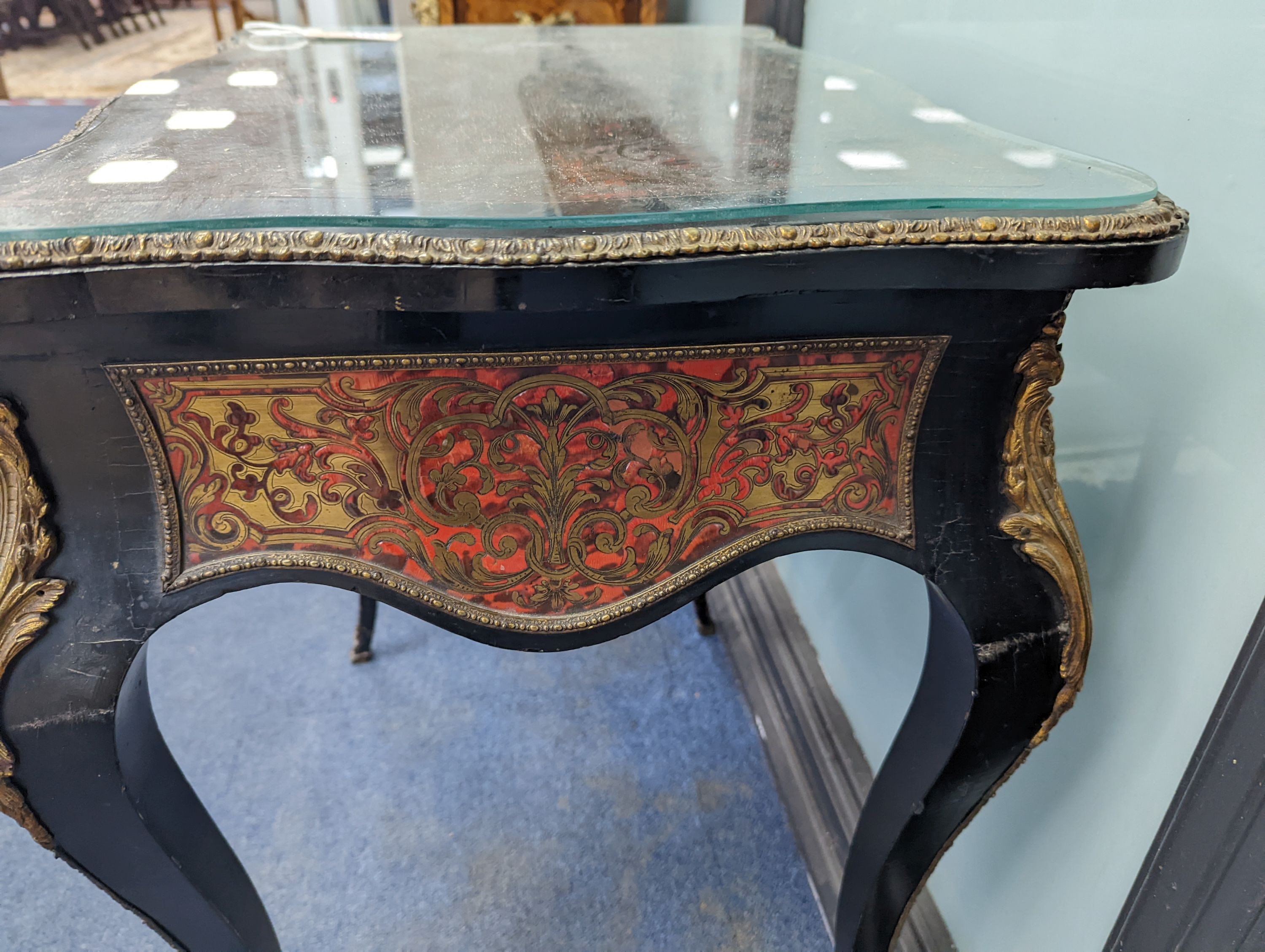 A 19th century French red Boullework poudreuse with mirrored internal lid and fitted interior, width 64cm, height 73cm